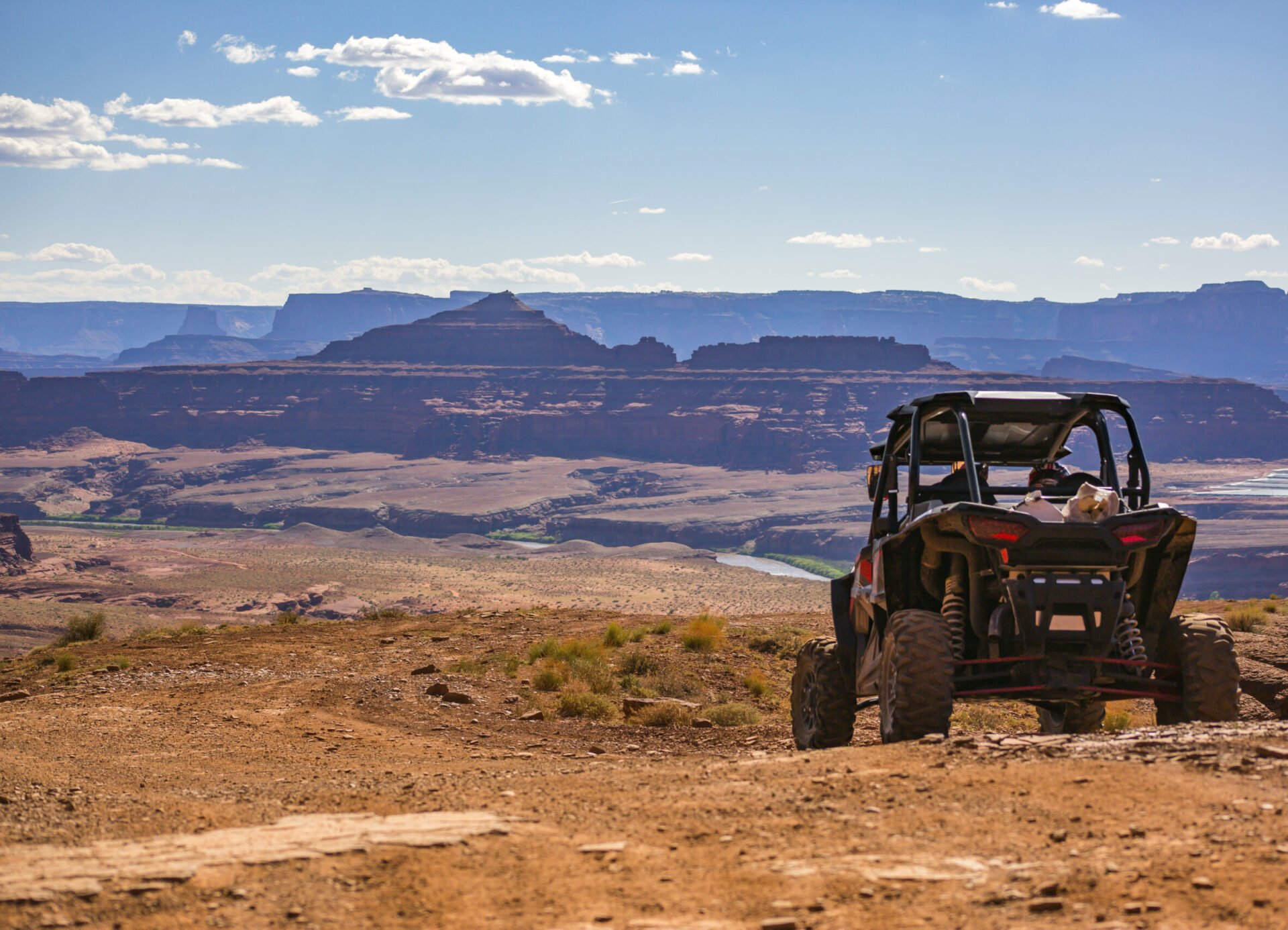 An off-road vehicle in front of a desert landscape in Moab, Utah.