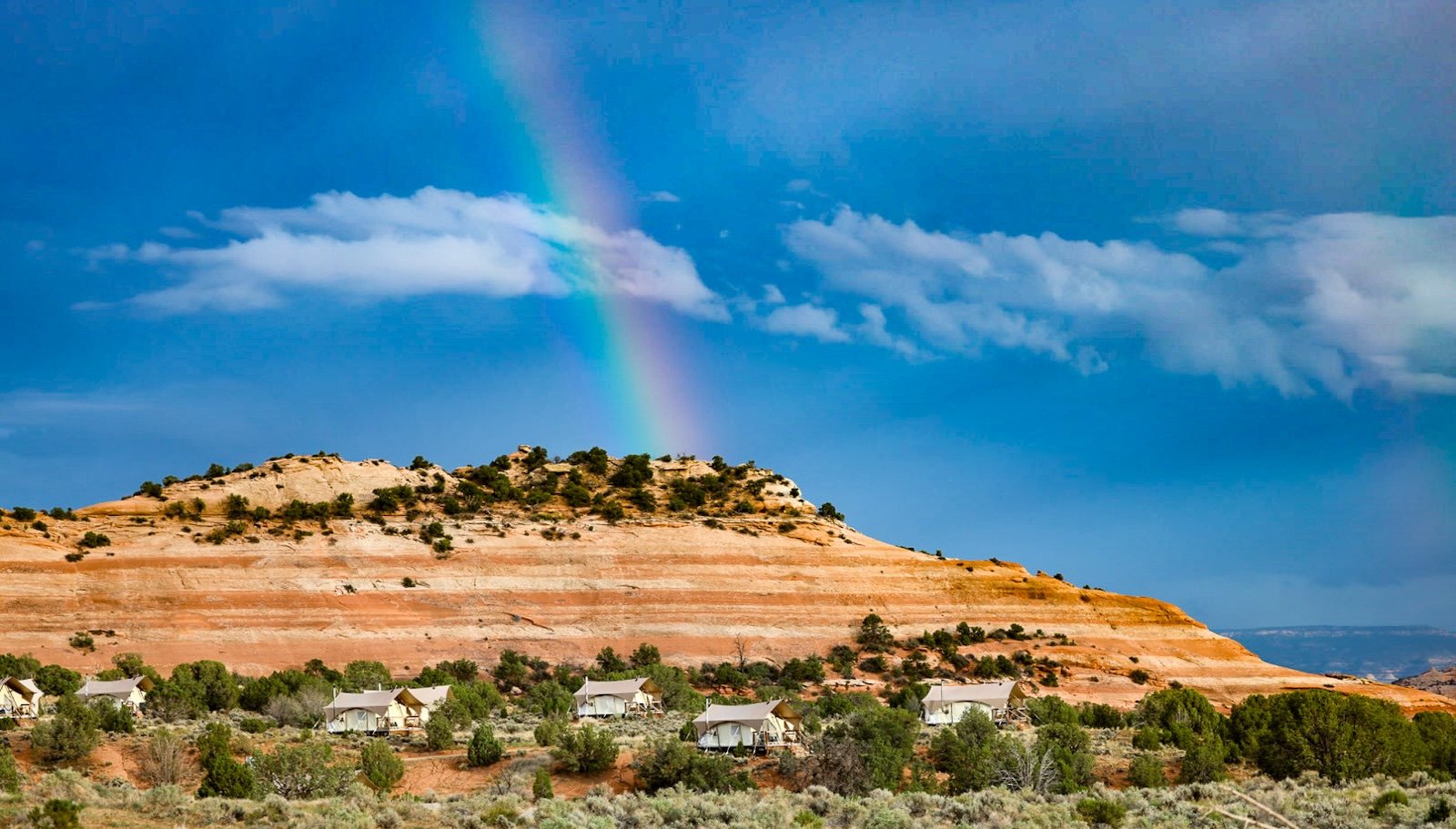 ULUM Moab with a rainbow above.