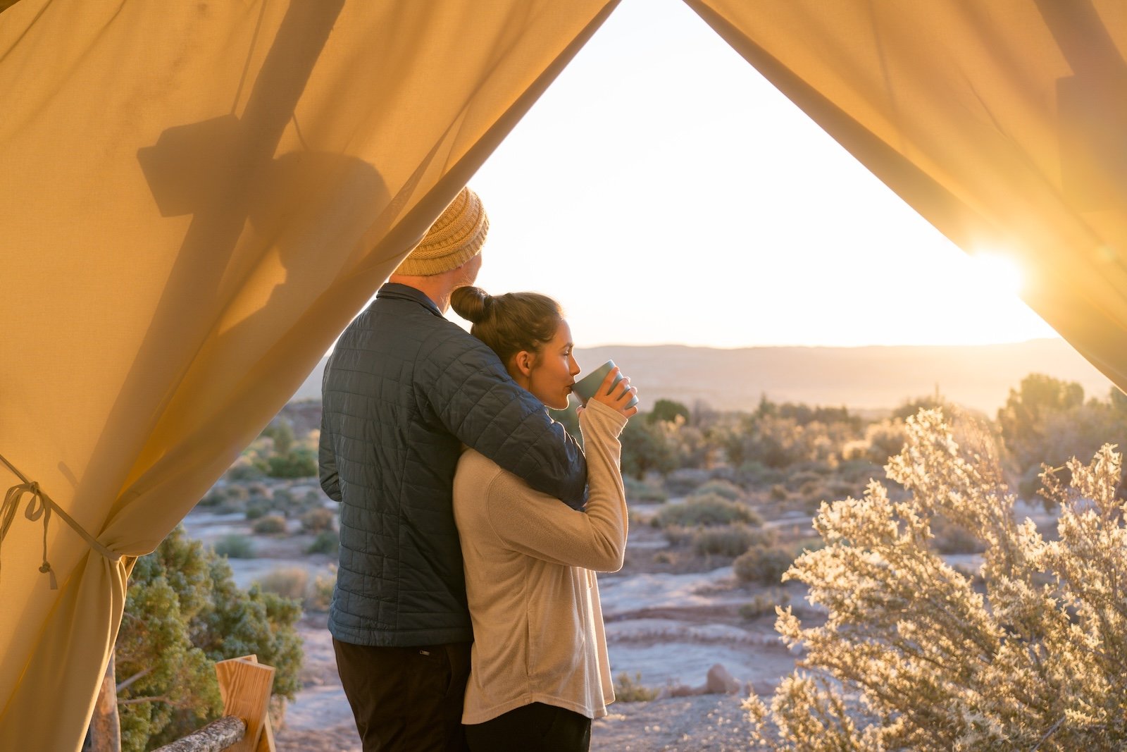 a Couple at ULUM moab during sunrise.