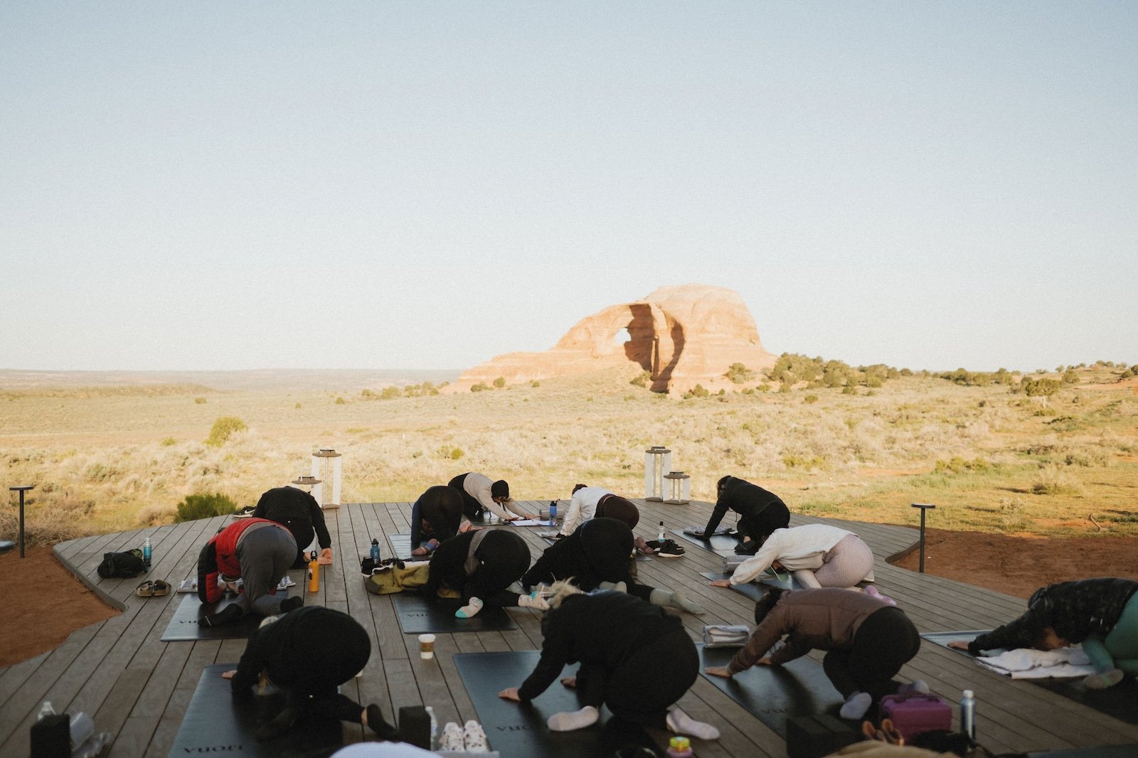 Yoga in front of Looking Glass Arch at ULUM resorts.