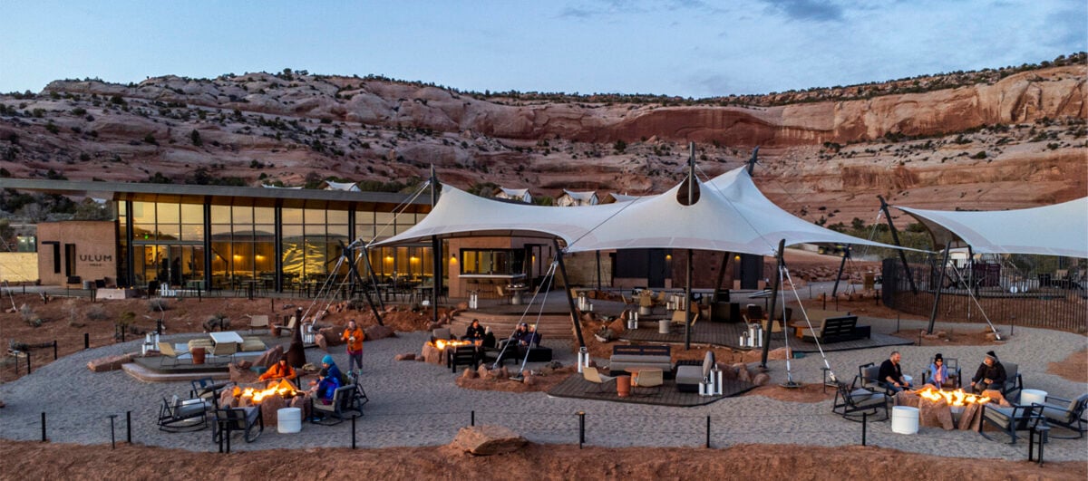 View of ULUM Moab's expansive lobby lounge at sunset