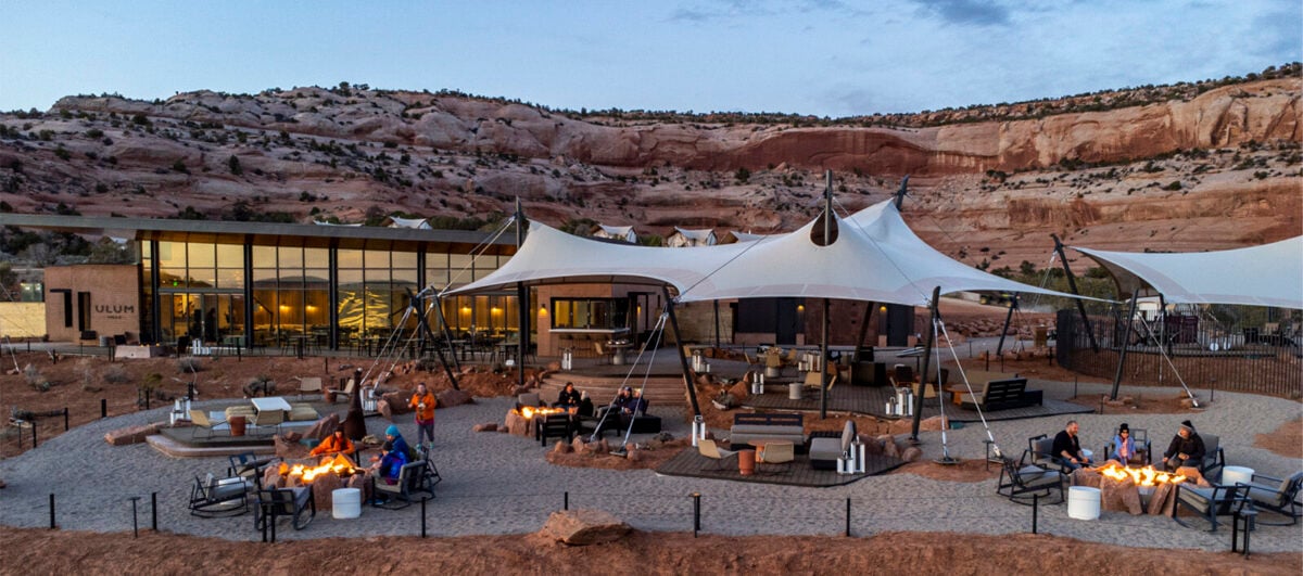 View of ULUM Moab's expansive lobby lounge at sunset