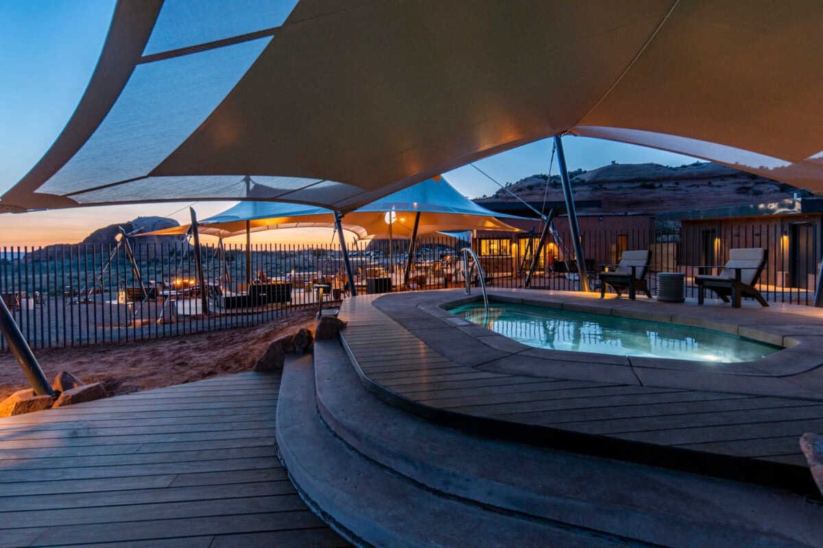 View of ULUM Moab's dipping pools at sunset