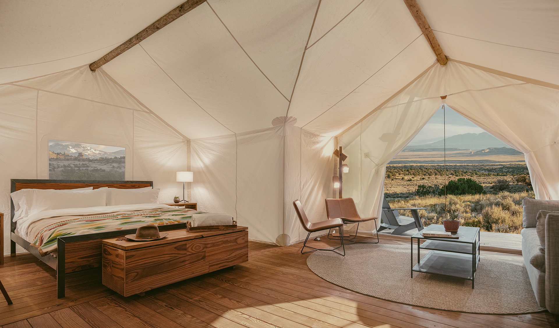 Suite Tent interior at ULUM Moab featuring Pendleton wool blankets and Parachute Linens