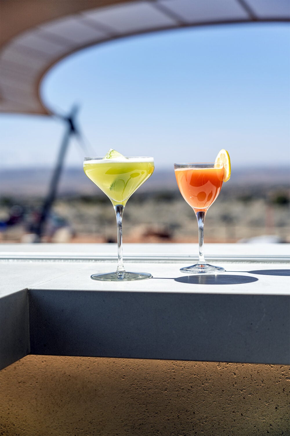 Two cocktails on a bar