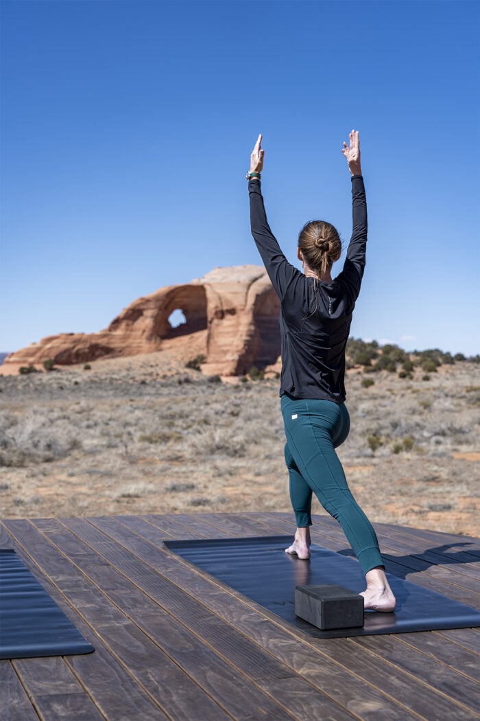 A guest at ULUM Moab participating in morning yoga.