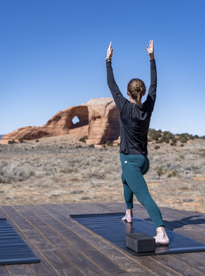 A guest at ULUM Moab participating in morning yoga.