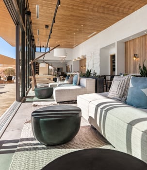 ULUM Resort's sunlight-filled lobby with floor-to-ceiling windows