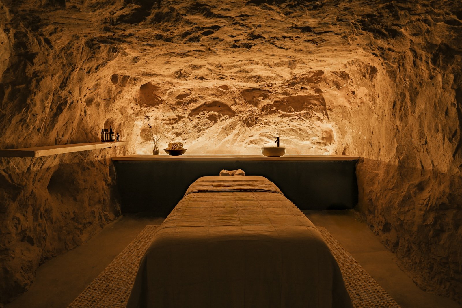 Massage area in a natural stone cave at ULUM Moab.
